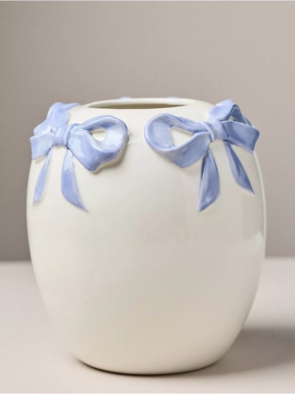 Anthropologie White Porcelain Vase with Light Blue Bow Accents